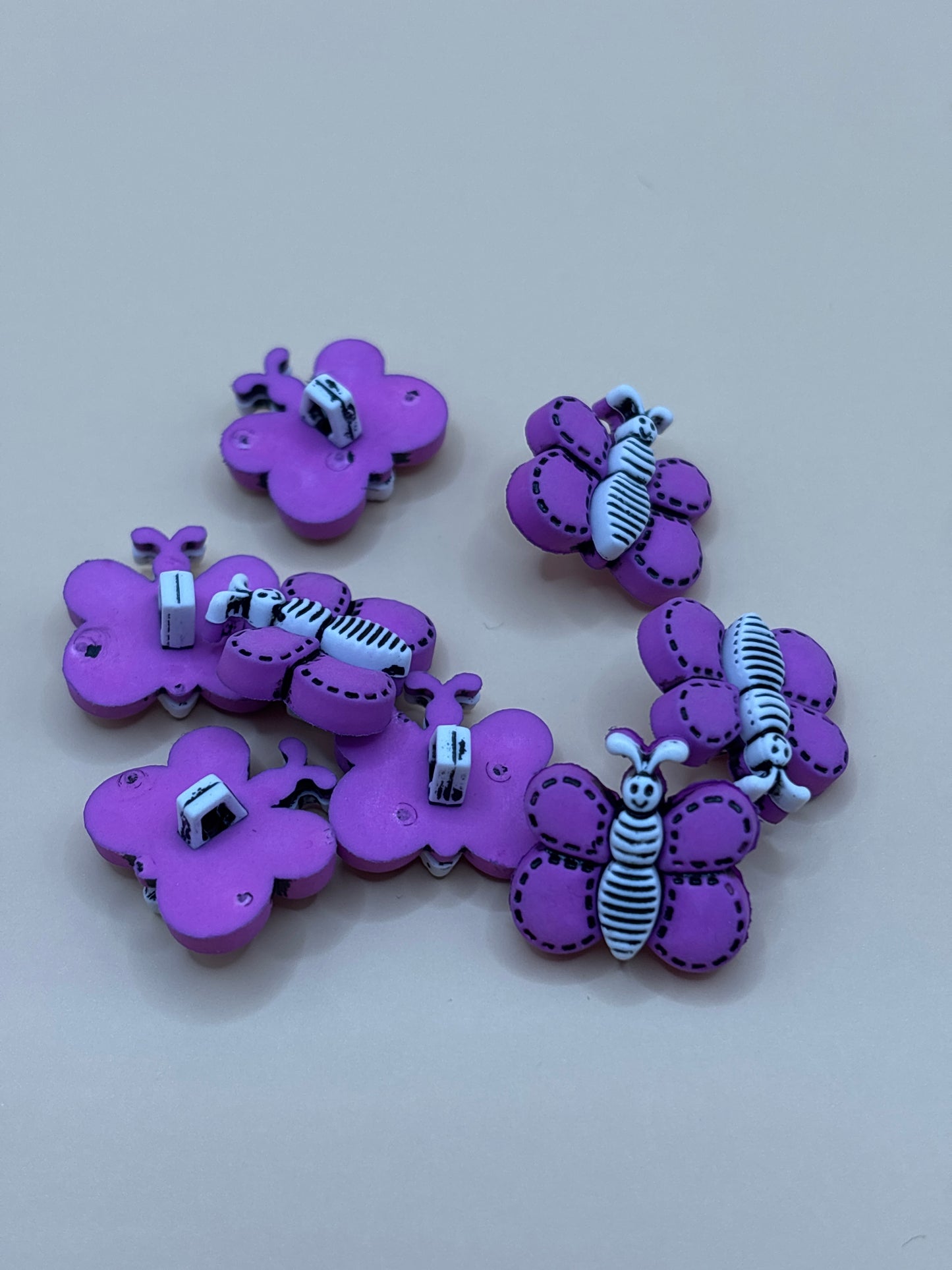 Purple butterfly shaped buttons