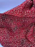 John Louden Christmas prints red and gold swirls