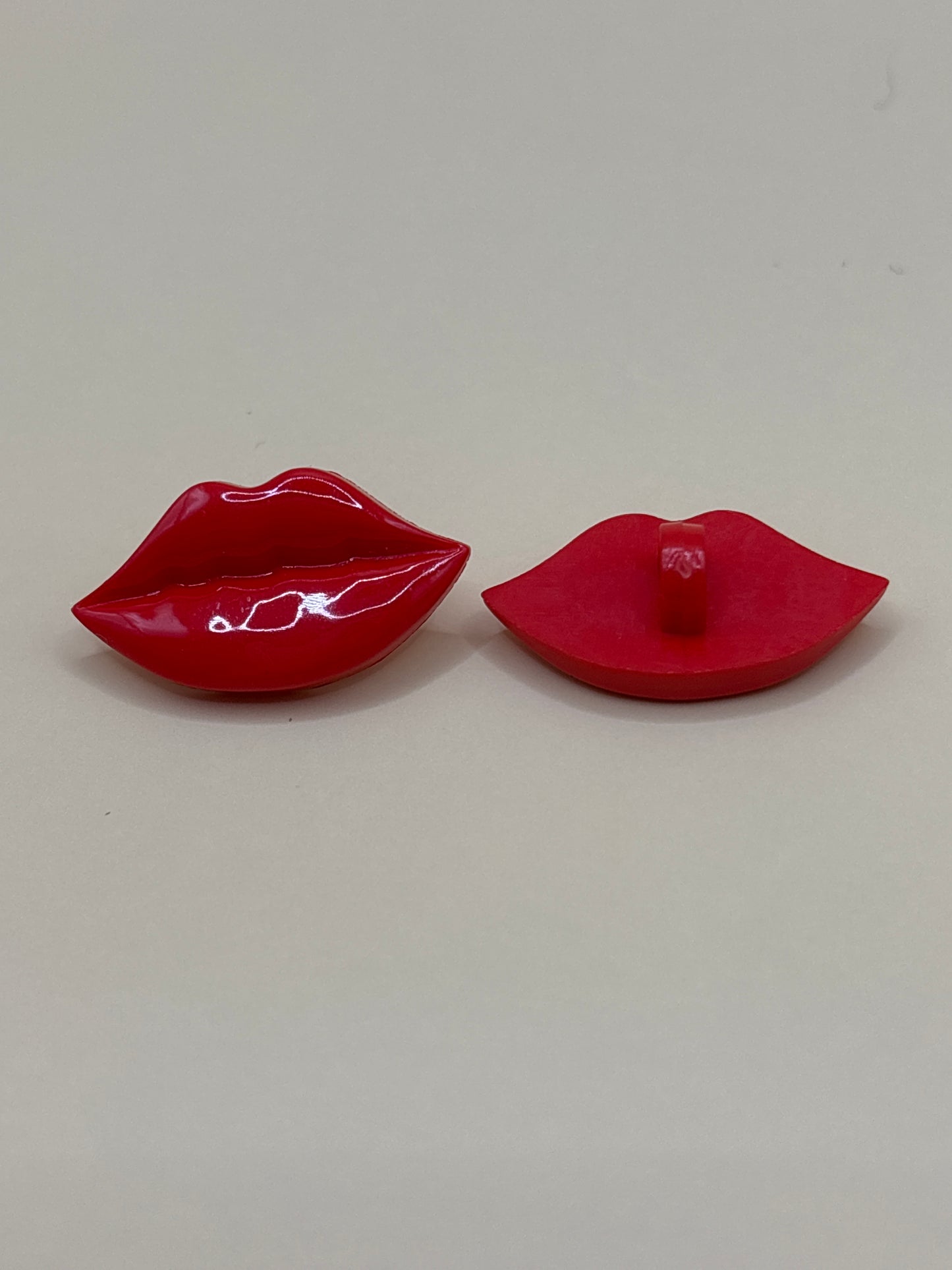Lip shaped button