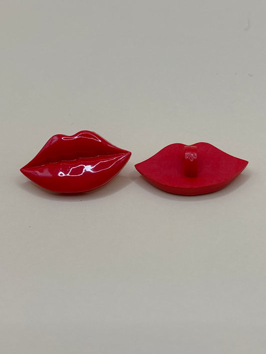 Lip shaped button